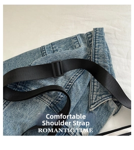Macro shot of durable blue denim fabric with adjustable black nylon strap and plastic buckle
