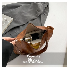 Internal view of brown vintage shoulder bag showing large capacity for cosmetics and items