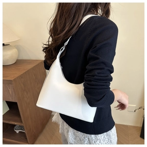 Detail of white hobo bag with smooth finish and adjustable metallic strap buckle