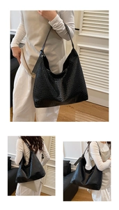 Detail of black woven leather tote bag featuring signature weave and fashion tag detail