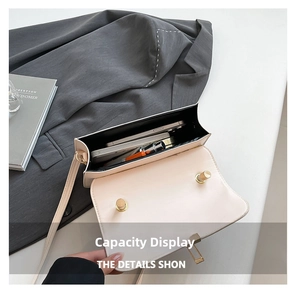 Interior view of beige crossbody bag showing capacity for phone and cosmetics