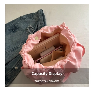 Top view showing large capacity interior of pink pleated canvas tote bag for essentials