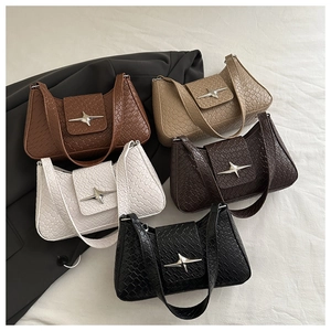 Detail shot of multi-color woven texture bags with silver star buckles and leather grain