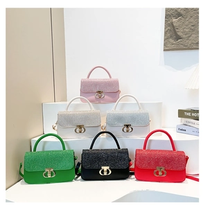 Detail view of multi-color mini bags featuring sequin patchwork and gold metal D-buckles