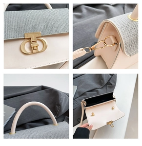 Detail of elegant gold CD logo buckle and woven texture on beige leather handbag