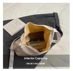 Spacious beige tote interior with yellow lining showing large storage capacity