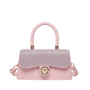 Pink PU leather crossbody bag with glitter flap and golden metal clasp on white background