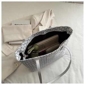 Spacious tote bag interior showing capacity for umbrella, wallet and daily items