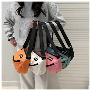 Detail showing five colors of nylon crossbody bags with adjustable straps and fashion labels