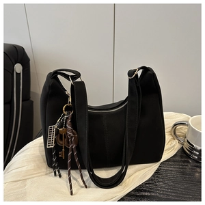 Retro black canvas tote bag with decorative pendants and large capacity for women