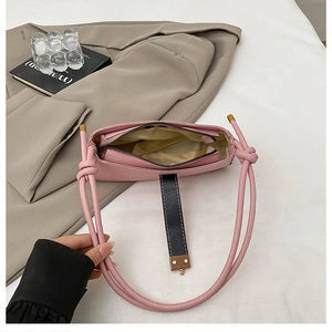 Detailed top view of pink leather baguette bag showing interior lining and zipper