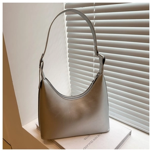 Detail of silver crescent hobo bag with matte metallic leather and adjustable strap