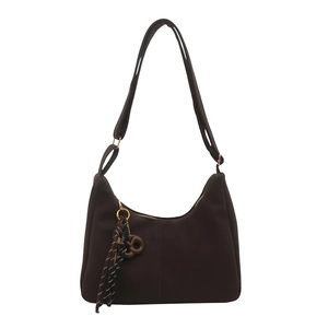 Premium dark brown vintage tote bag with adjustable strap and decorative woven pendant