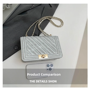 Silver quilted crossbody bag with gold chain and phone for size comparison