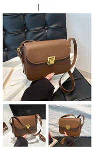Détails d'un sac bandoulière marron vintage avec fermoir métallique carré doré brillant