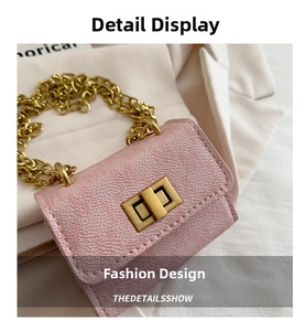 Close-up of pink litchi grain leather mini bag with gold hardware and chain strap