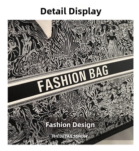 Close-up of intricate black and white embroidery detail with Fashion Bag strap logo
