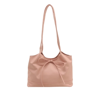 Minimalist pink faux leather tote bag with bow detail and large capacity shoulder straps
