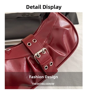 Detail of burgundy patent leather shoulder bag featuring pleated texture and buckle strap