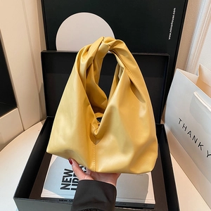 Chic yellow pleated leather bucket handbag for women with knot handle for commute