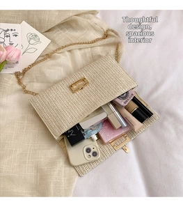 Interior view of off-white woven crossbody bag showing large capacity and chain strap