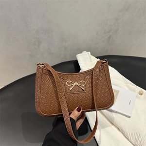 Brown woven texture baguette handbag with gold bow buckle and slim shoulder strap