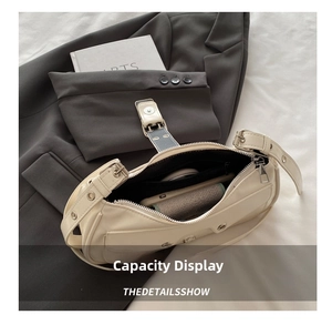 Detailed internal view showing storage capacity of a beige French style shoulder bag