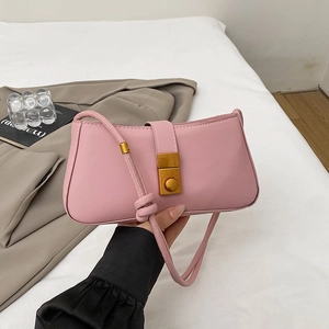 Pink matte leather baguette shoulder bag with vintage gold buckle and knotted strap detail