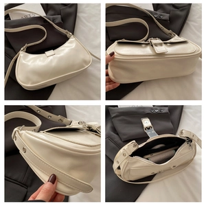 Detail view of beige shoulder bag showing base thickness, side stitching and interior capacity