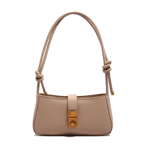 Beige rectangular underarm bag with knot strap details and gold metal clasp closure