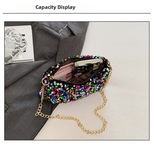 Detail showing the internal capacity of colorful sequined crossbody bag with gold chain