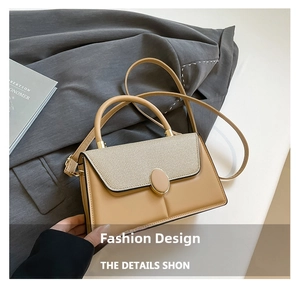 Detail of khaki leather handbag with beige woven flap and elegant gold hardware