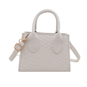White faux crocodile leather handbag with golden hardware and adjustable strap for women