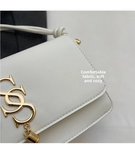 Detail view of white leather square bag with gold interlaced logo and stitching