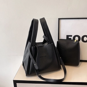 Minimalist black lychee leather bucket tote bag set with adjustable shoulder strap