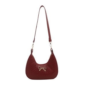 French hobo shoulder bag in burgundy crocodile pattern with golden bow hardware