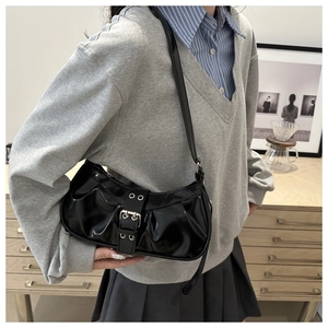 Chic black pleated croissant bag with silver buckles styled for casual daily fashion