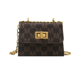 Mini floral crossbody bag with dark brown monogram pattern and golden chain strap