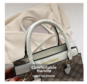 Detail of white and brown monogram leather handbag with FASHION&BAG lettering and metal buckle