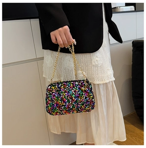 Detailed view of colorful sequins on a small crossbody bag with premium gold chain strap
