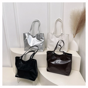 Collection of minimalist glossy tote bags in silver, cream, black, and dark brown colors