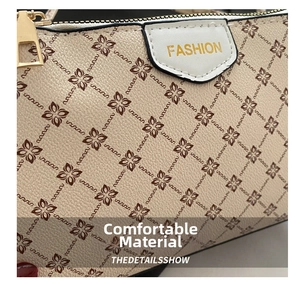 Dettaglio borsa a tracolla beige con motivo floreale e cerniera in metallo dorato