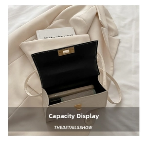 Top view of the off-white handbag interior showing capacity for phone and cosmetics