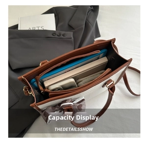 Top view of white tote bag interior showing large capacity for tablet and daily essentials