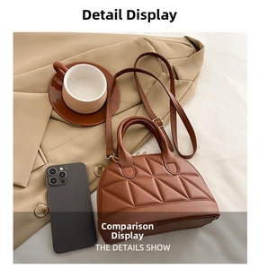 Brown quilted shell handbag with gold hardware displayed in a lifestyle setting