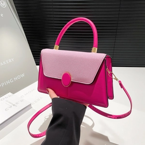 Minimalist patchwork pink crossbody handbag with gold hardware and top handle for women