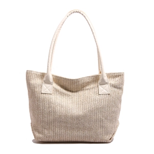 Minimalist woven tote bag with V-shaped texture and faux leather straps for summer
