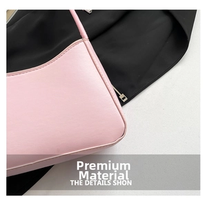 Close-up of pink quilted leather shoulder bag featuring fine stitching and premium texture