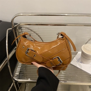 Caramel glossy PU leather crescent underarm bag with decorative metal buckle straps
