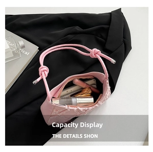 Pink tweed underarm bag interior showing capacity for lipstick and small essentials